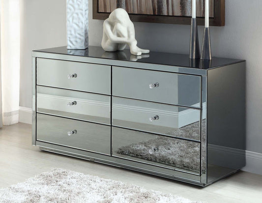 PedastalsTransform your bedroom into a luxurious haven with our Glass Mirror Chest of 6 Drawers. Its mirrored surface adds depth and elegance to your interior, while the six Luxe Living InteriorsGlass Mirror Chest